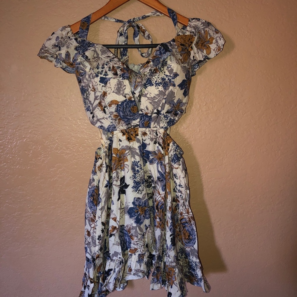 Brand new floral romper with cut outs!